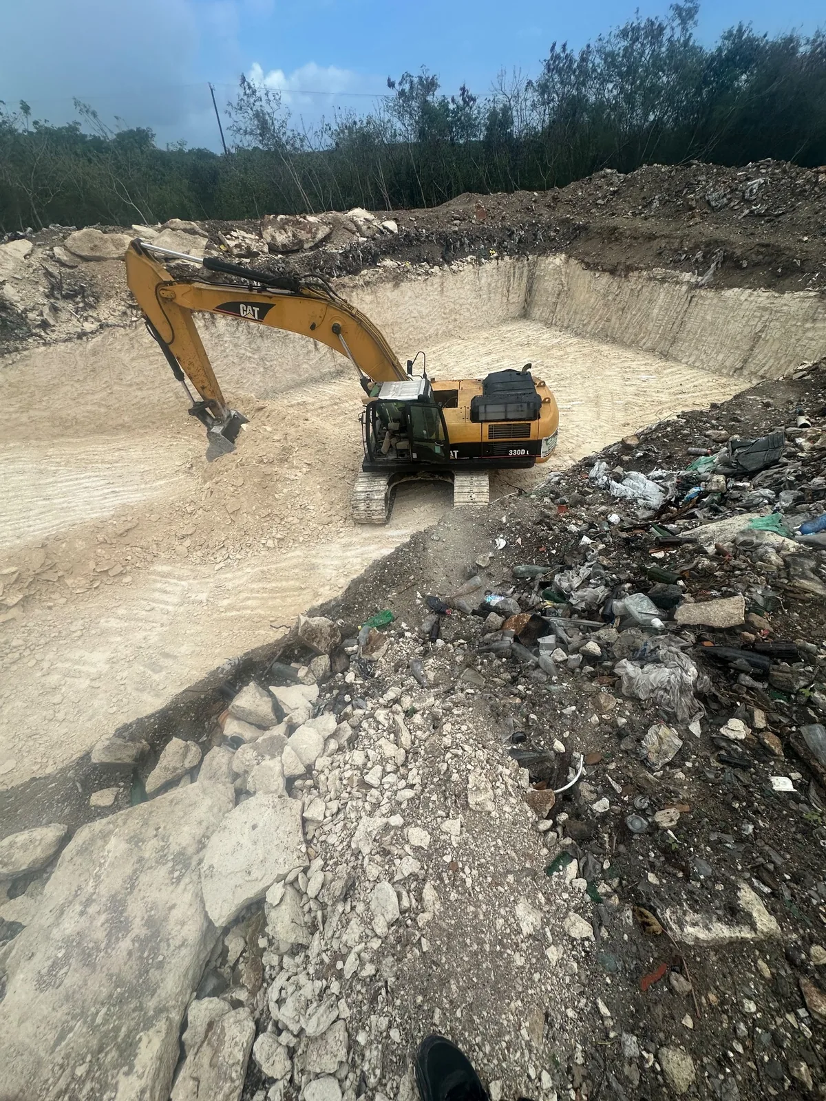 Excavator working below grade